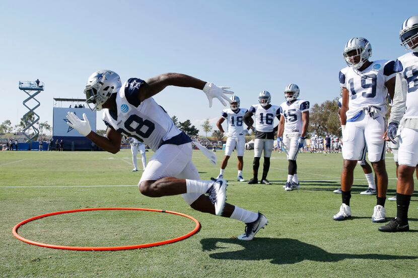 Dallas Cowboys wide receiver Dez Bryant (88) runs around the loop in a drill during training...