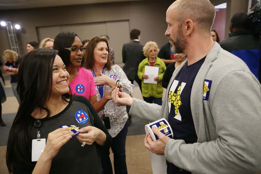 From left: Ami Dominguez, Rita Russell and Stephanie Baca received Hillary Clinton stickers...