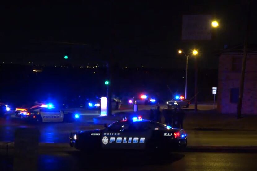 Dallas police at the scene of a fatal officer-involved shooting in which multiple officers...