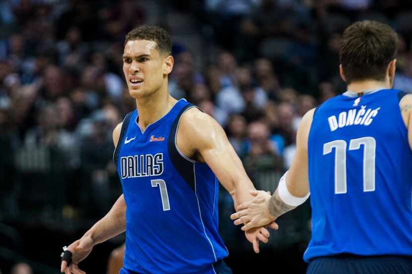 Dallas Mavericks forward Dwight Powell (7) and forward Luka Doncic (77) celebrate a point...