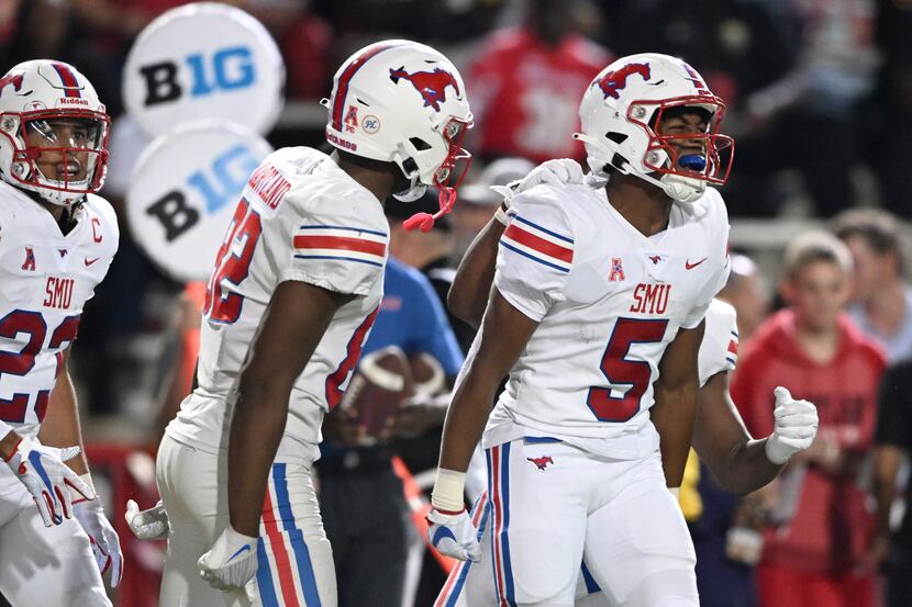SMU wide receiver Moochie Dixon, right, celebrates after his touchdown against Maryland in...