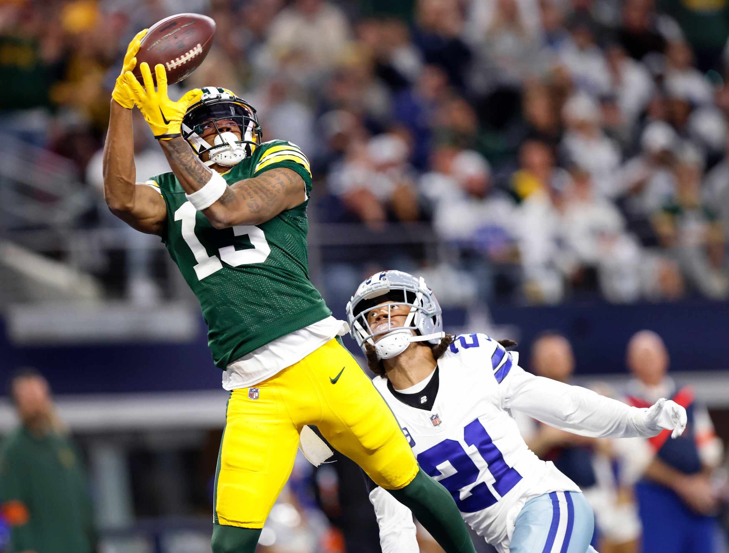 Green Bay Packers wide receiver Dontayvion Wicks (13) pulls in a second quarter pass in the...