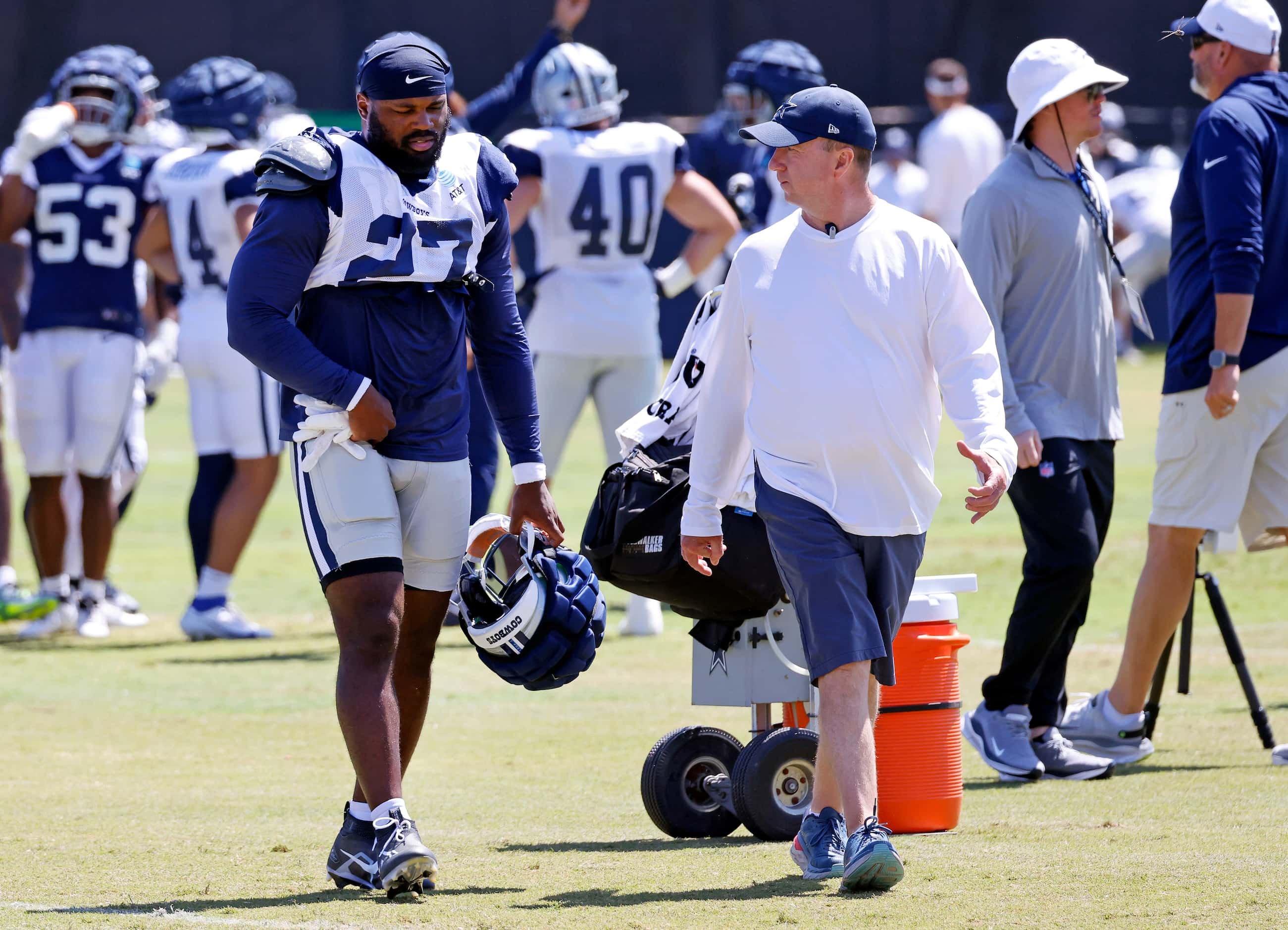 Dallas Cowboys running back Royce Freeman (27) walks to the medical tent after sustaining an...