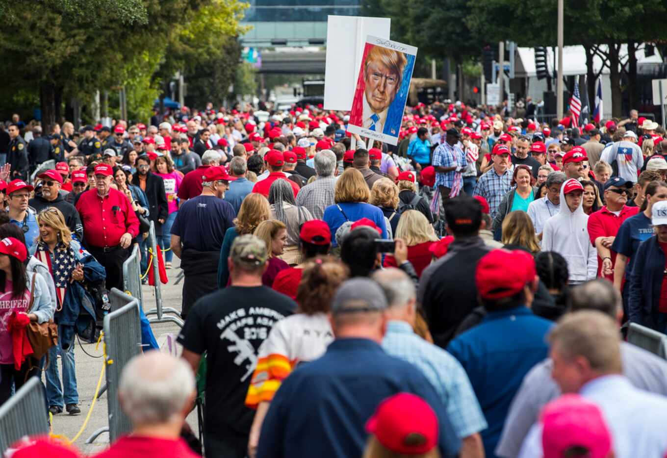 People wait for a rally for Republican Sen. Ted Cruz by President Donald Trump at Toyota...