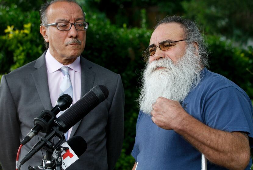 Juan Moreno Sr ( right) and Carlos Quintanilla speak to the media outside the Moreno home in...