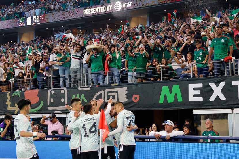 Mexico players celebrate after Mexico forward Cesar Huerta (21) scored against Australia...
