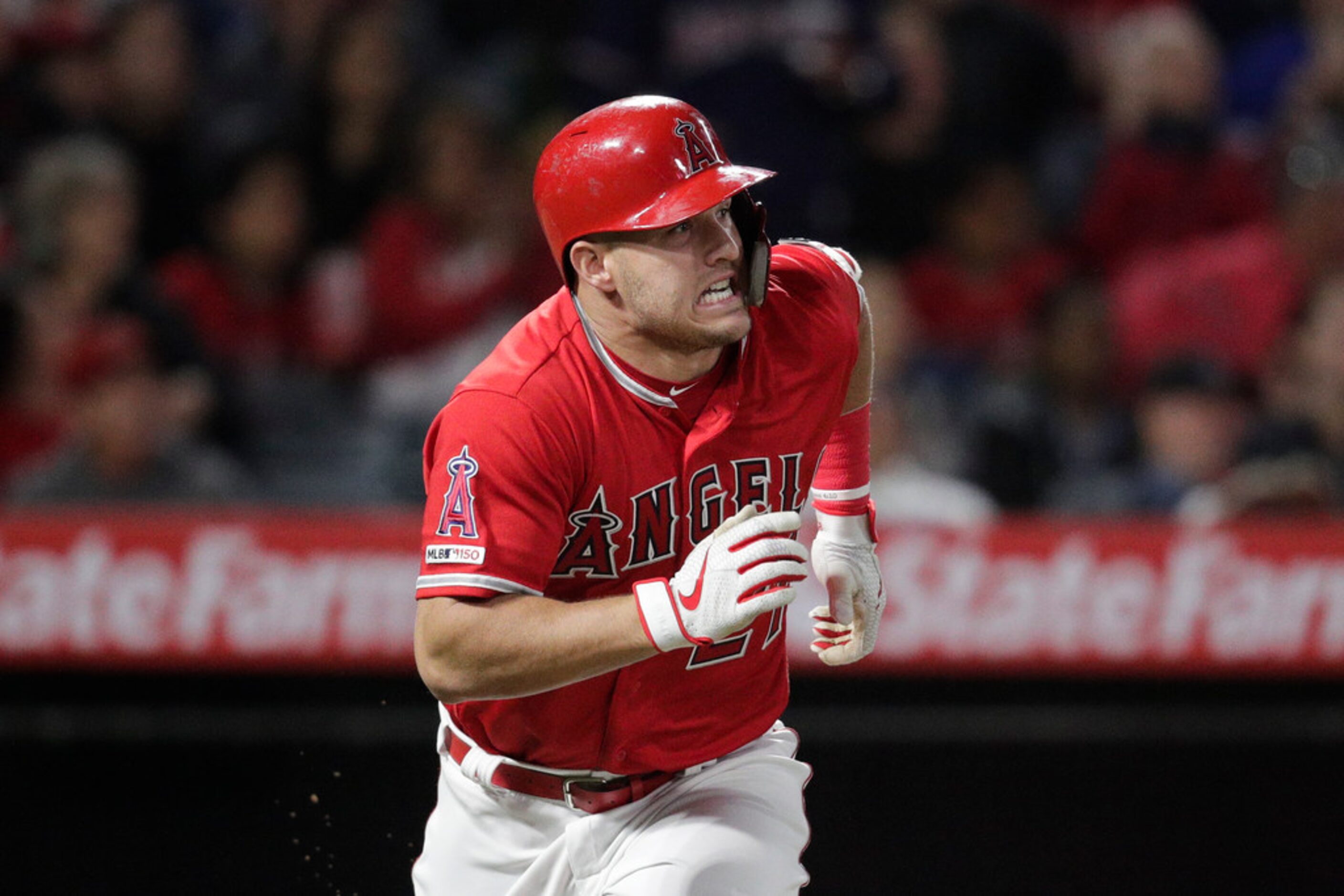 Los Angeles Angels' Mike Trout watches his home run during the sixth inning of the team's...