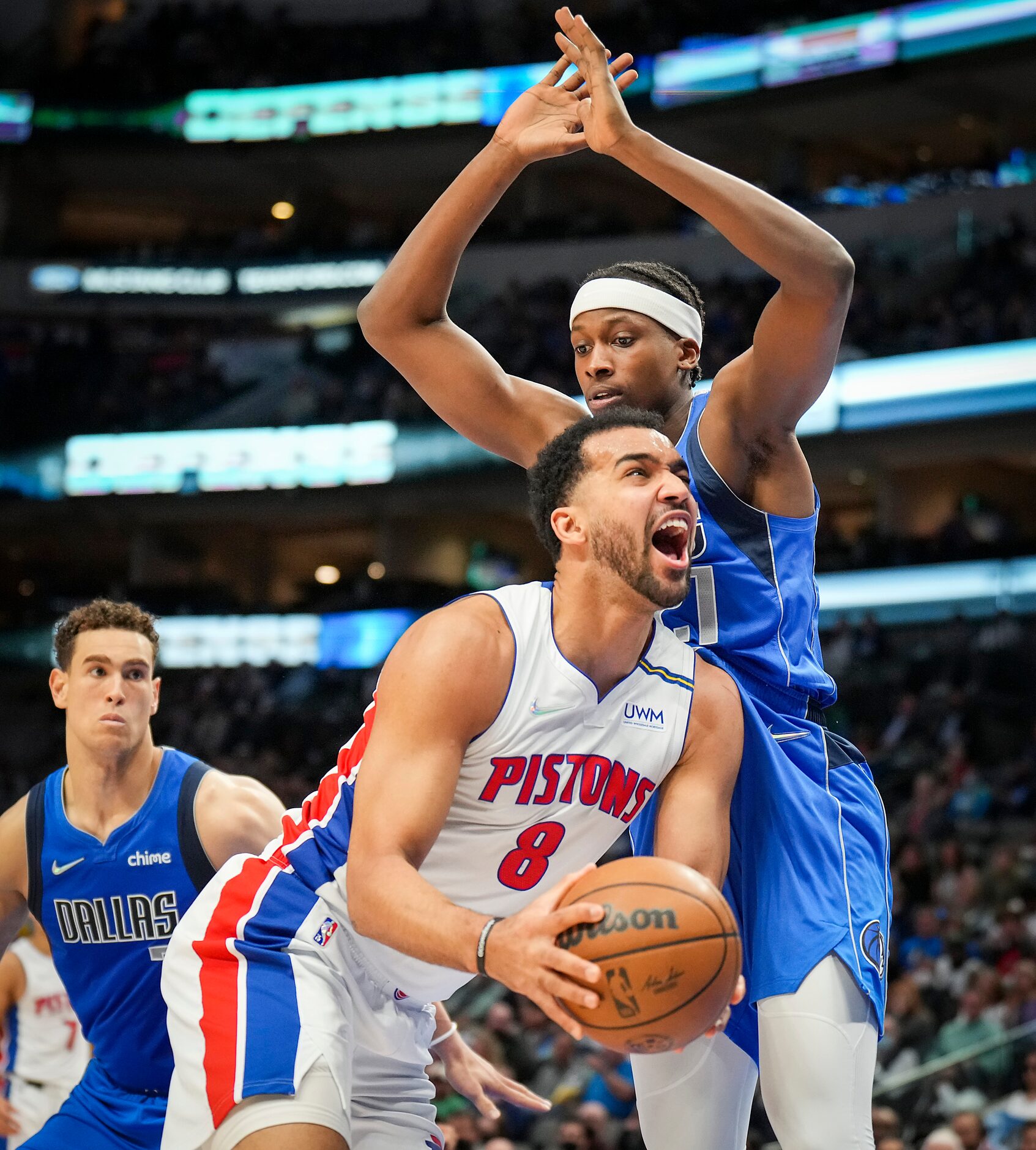 Detroit Pistons forward Trey Lyles (8) is fouled by Dallas Mavericks guard Frank Ntilikina...