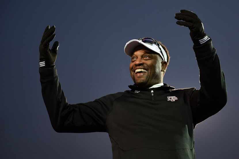 Head coach Kevin Sumlin of the Texas A&M Aggies looks to the crowd following a victory over...