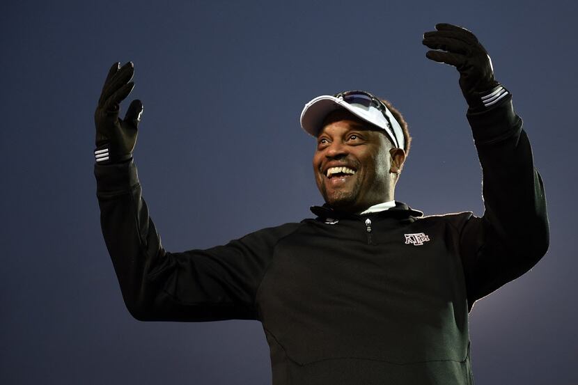 Head coach Kevin Sumlin of the Texas A&M Aggies looks to the crowd following a victory over...