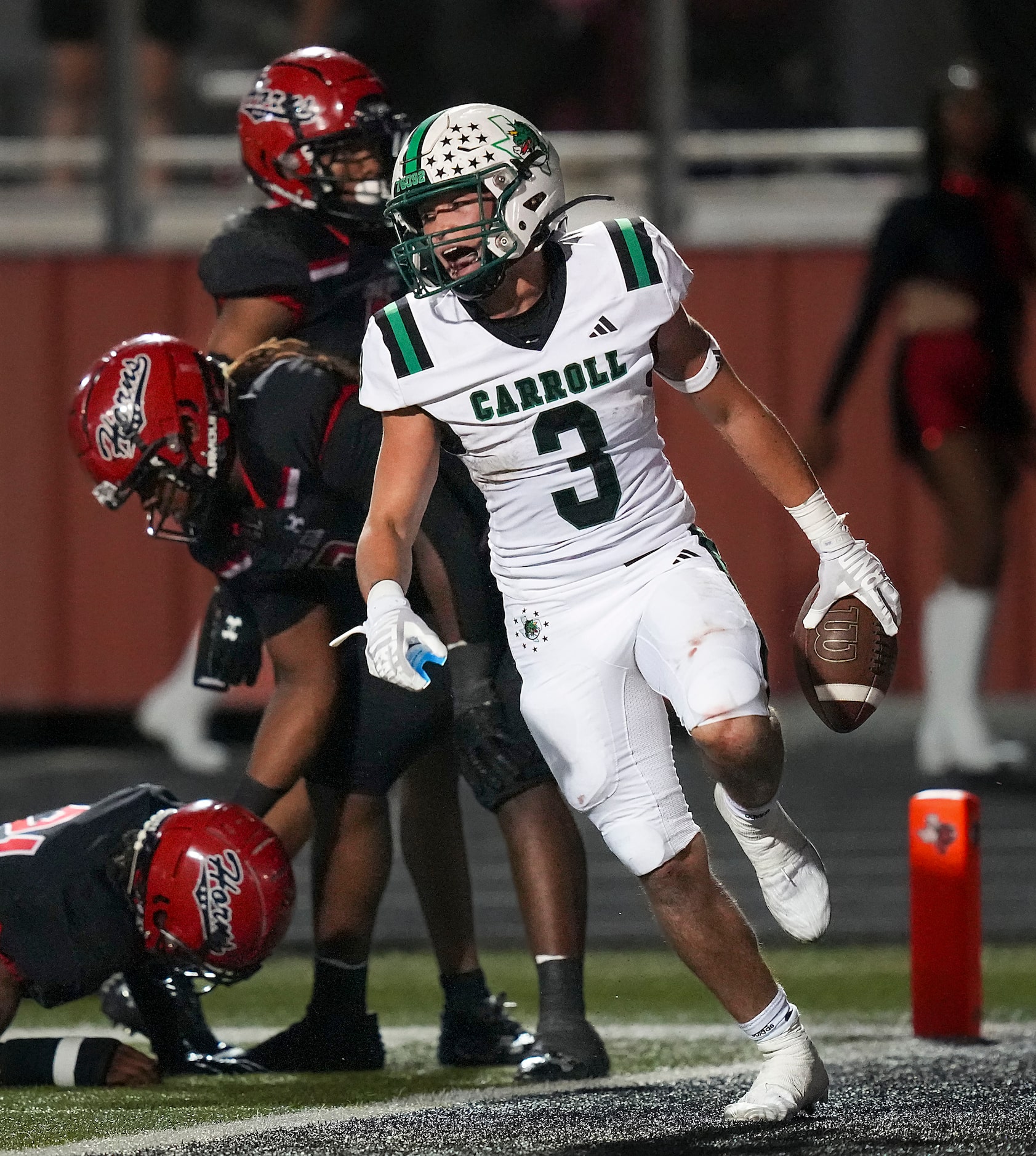 Southlake Carroll running back Davis Penn (3) celebrates after a 62-yard run to the Cedar...