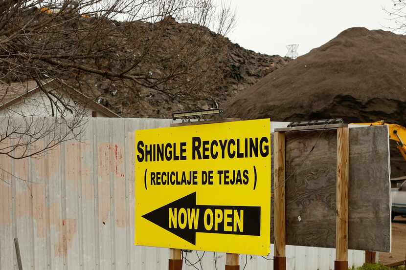 A large hill of recycled shingles is seen at Blue Star Recycling, near the home of Marsha...