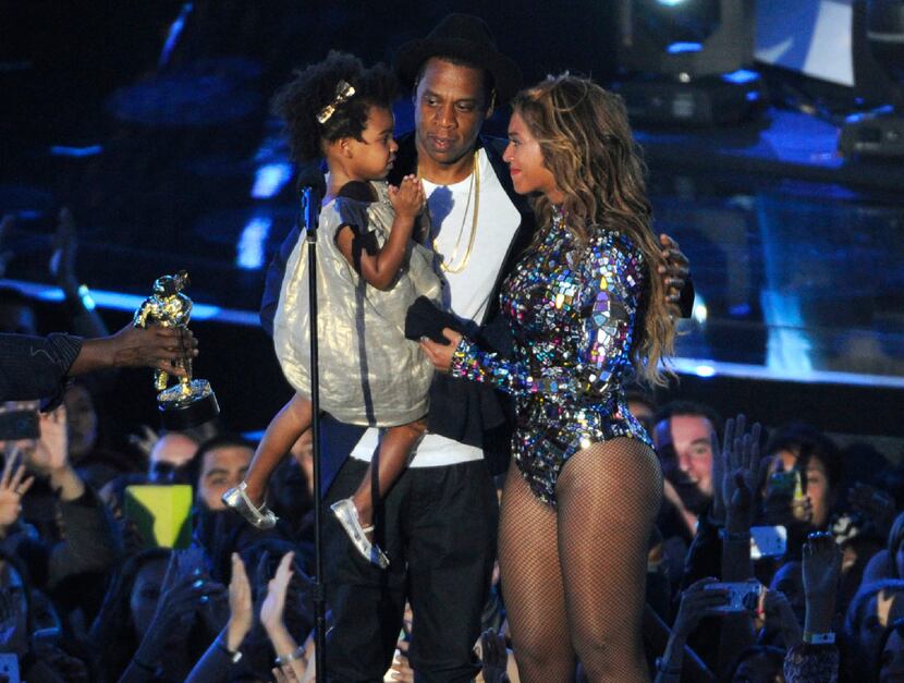 Beyonce, on stage with Jay Z and their daughter Blue Ivy, accepts the Video Vanguard Award...