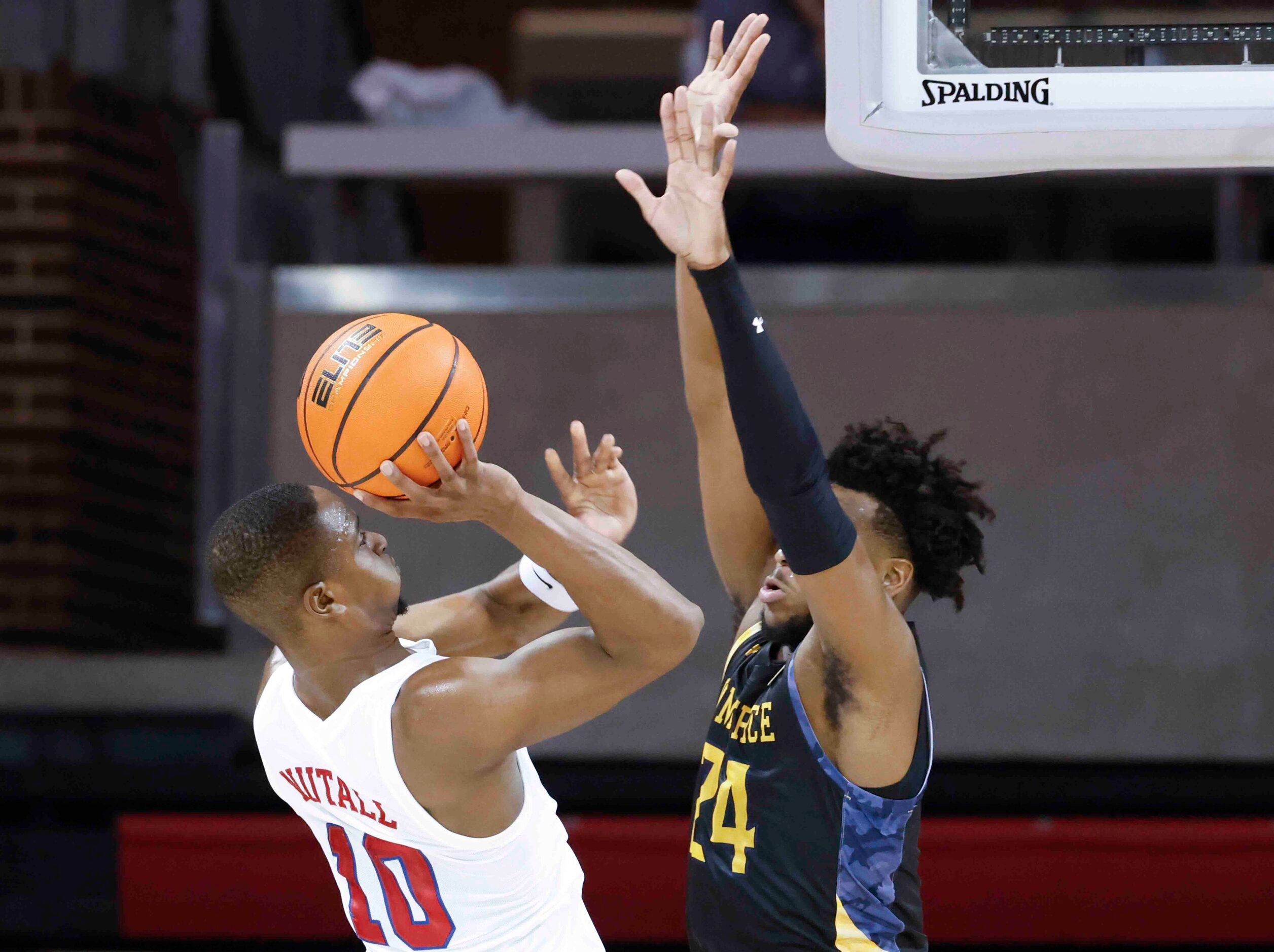 Southern Methodist guard Zach Nutall (10), left, shoots past  Texas A&M-Comm’s Jerome Brewer...