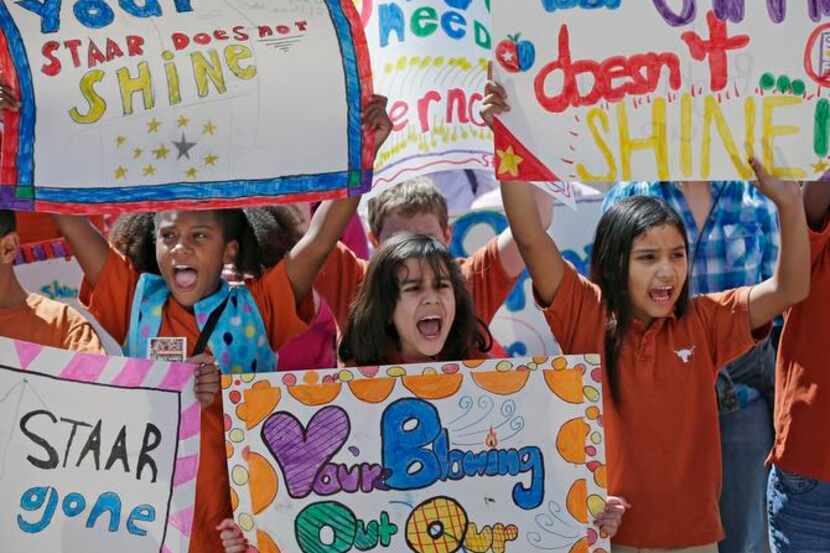 
Austin students  (from left) Marlee Foster, Maricaren Marquez and Anastacia Ortega rallied...