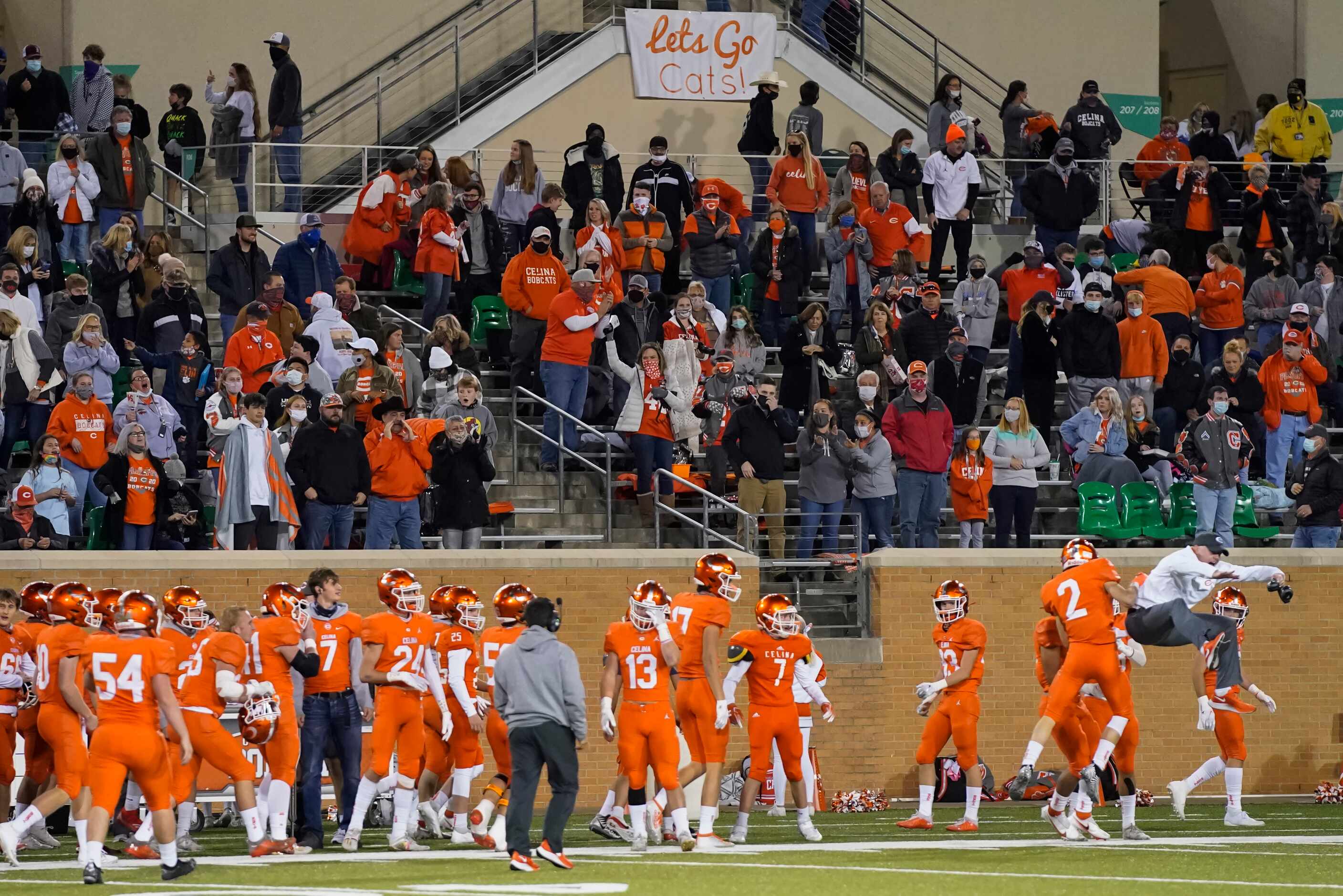 The Celina crowd celebrates after wide receiver Collin Urich (2) returned the opening...