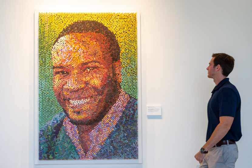 Andrew Veazey looks at artwork of Botham Jean as it hangs hangs on the wall  on Wednesday,...