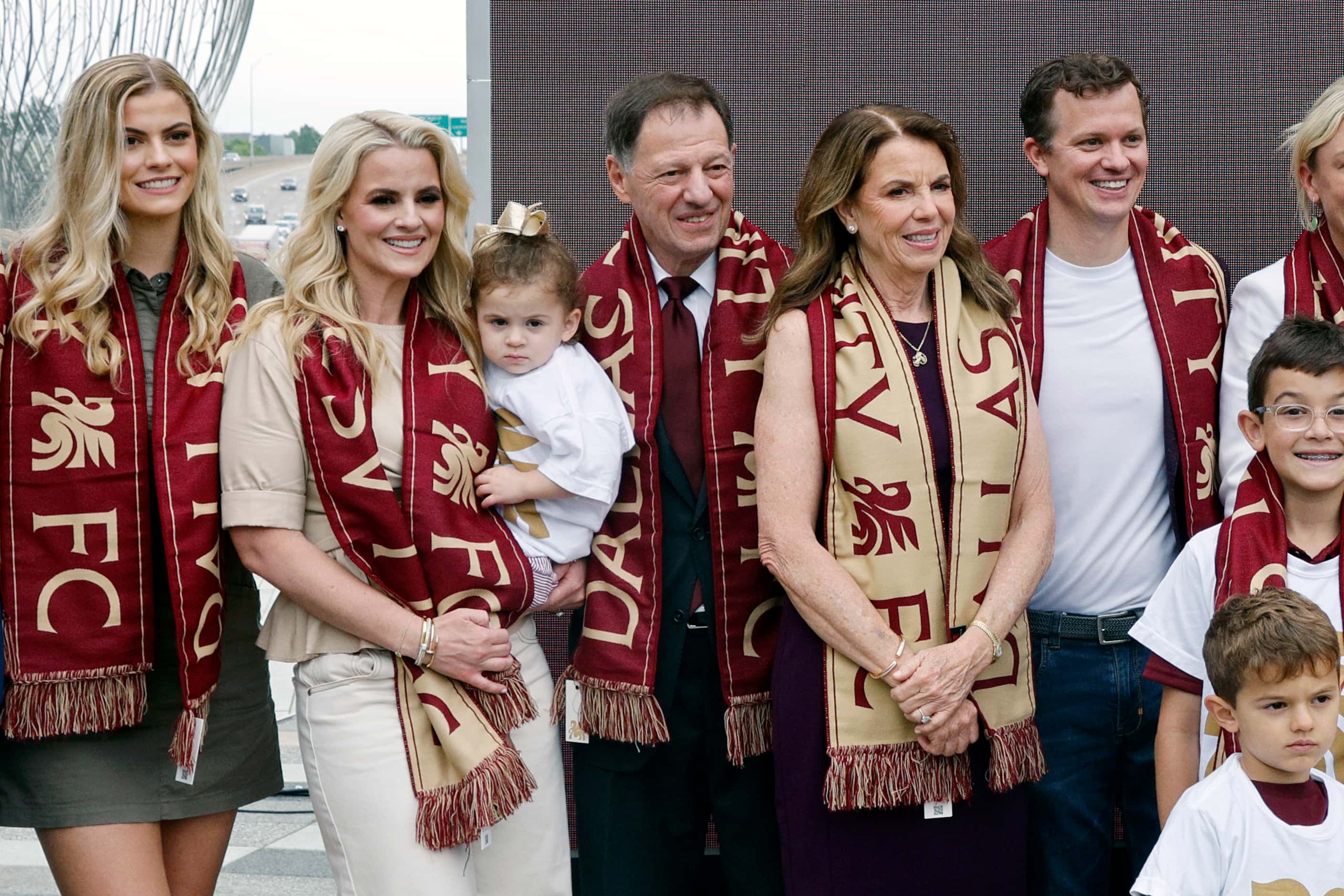 Dallas Trinity FC CEO Jim Neil (center) stands for photos with his family after unveiling...