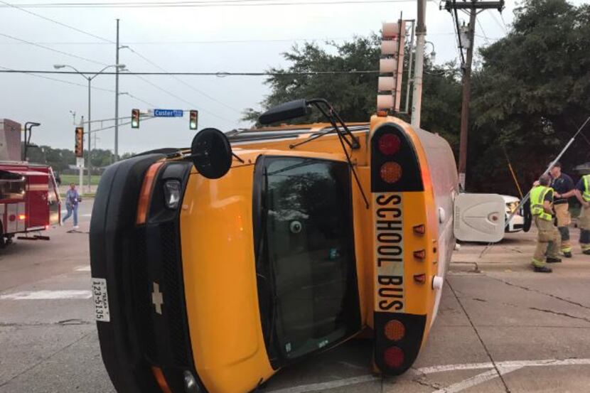 A school bus lies overturned in Richardson on Friday morning after hitting a vehicle. No one...