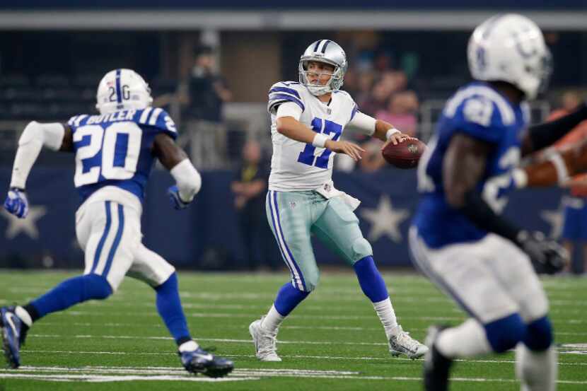 Dallas Cowboys quarterback Kellen Moore (17) is pressured by Indianapolis Colts free safety...