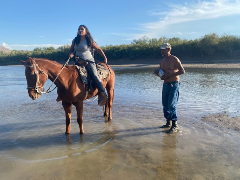 Beronica Ureste rides her horse to the middle of the Rio Grande on Tuesday, Nov. 2, to...