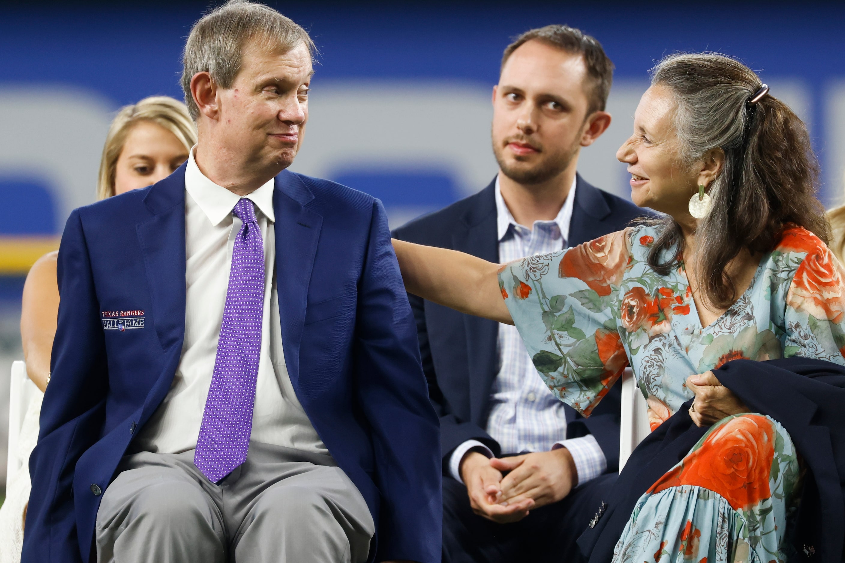 Executive VP of Public Affairs VP John Blake, left, gets comforted by his wife Harriet Blake...