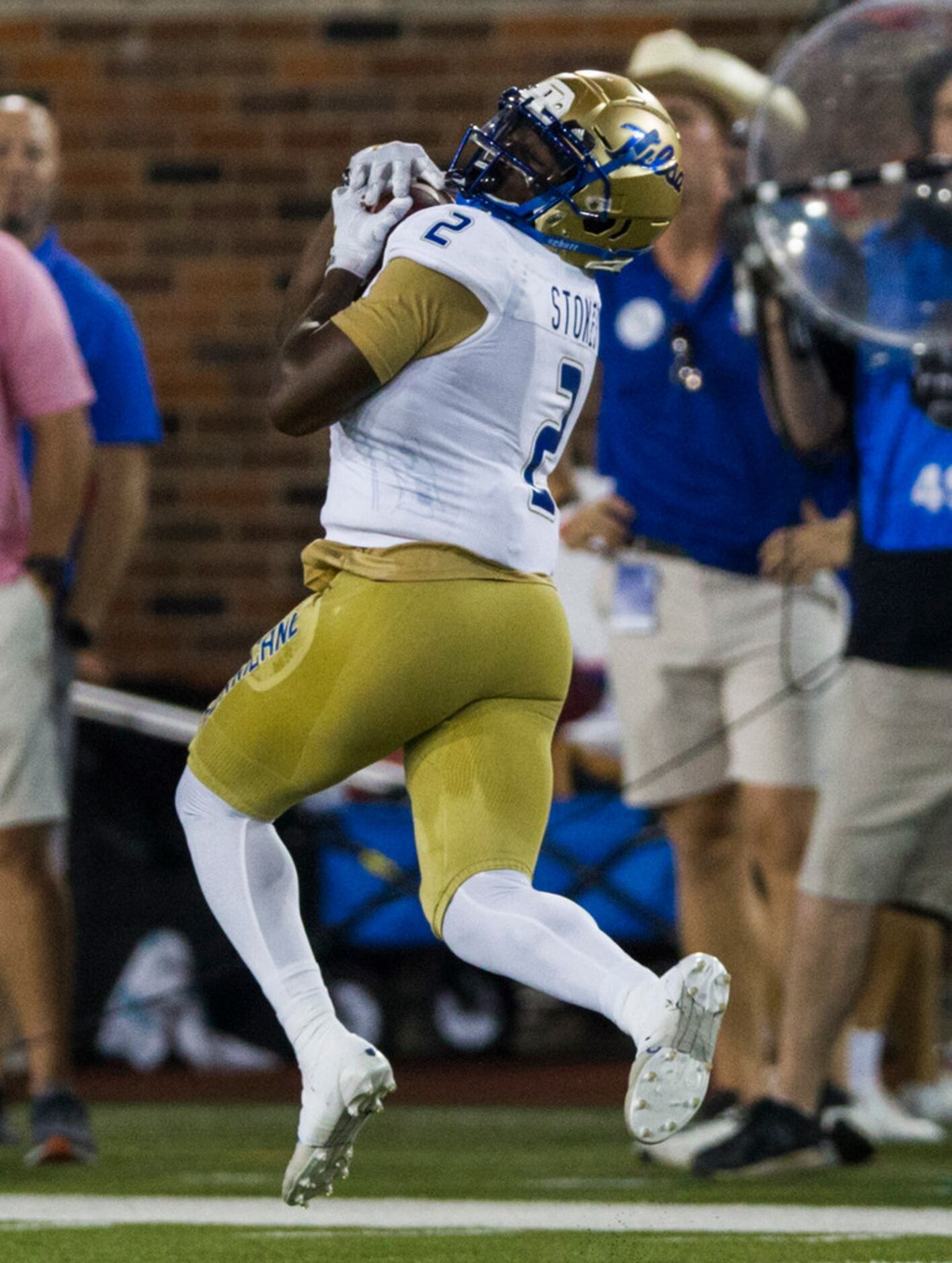 Tulsa Golden Hurricane wide receiver Keylon Stokes (2) catches a pass and then runs to the...