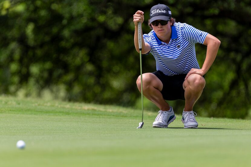 Plano West's Matt Comegys studies his shot on the 1st green during round 2 of the UIL Class...