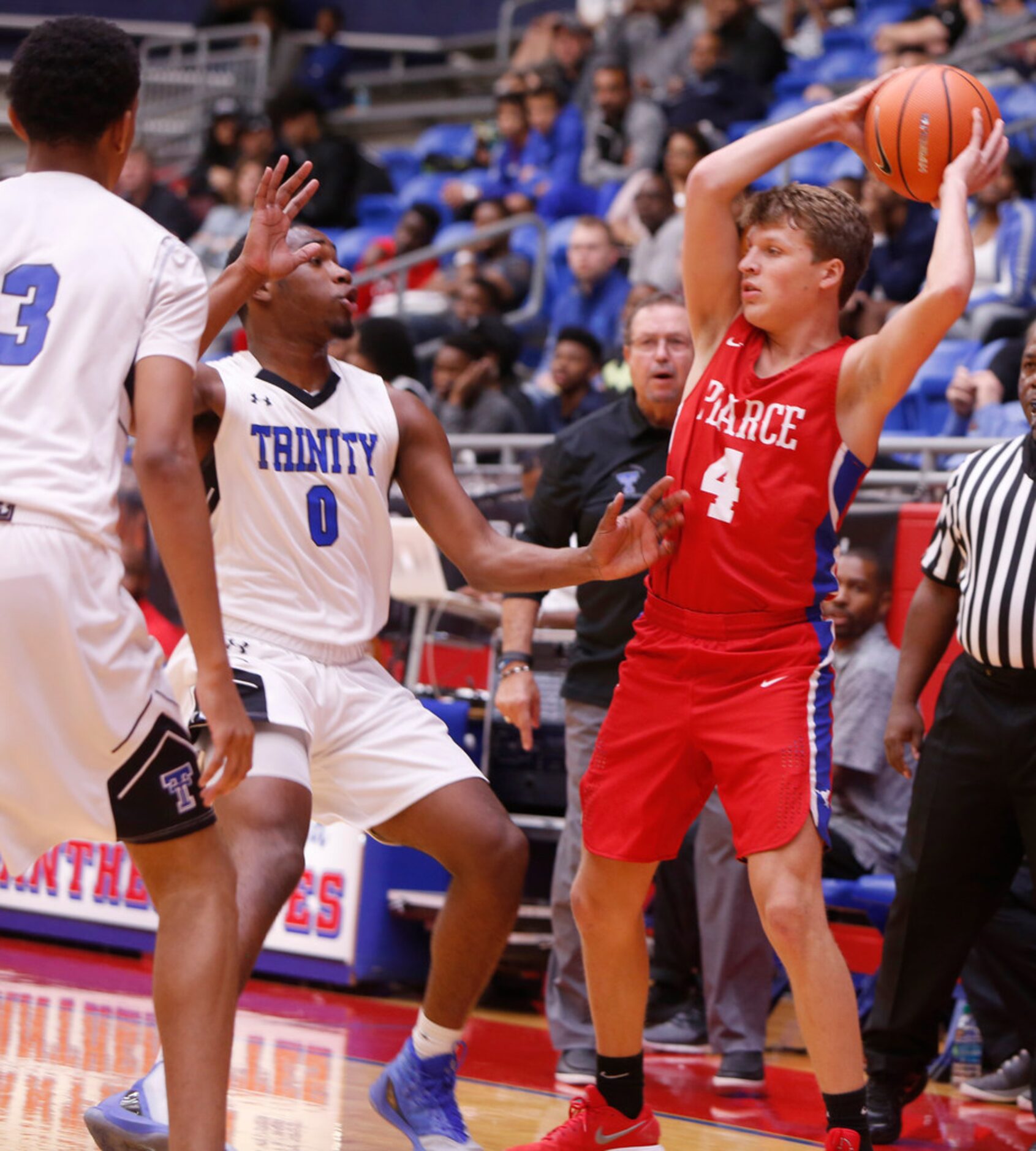 Richardson JJ Pearce guard Joseph Kelley (4) looks to pass beyondTrinity Christian defenders...