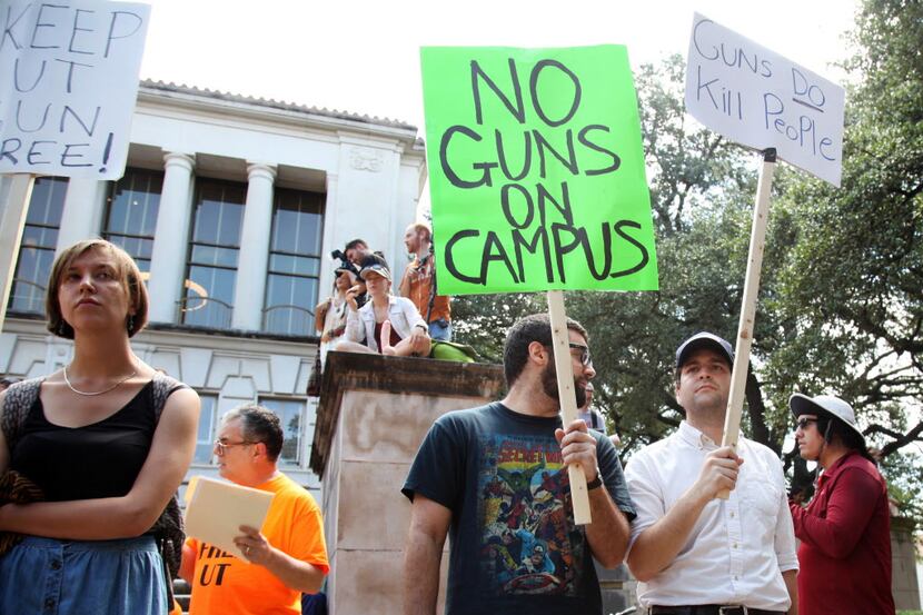 Students held signs and sex toys as they protested campus carry Aug. 24 in Austin.