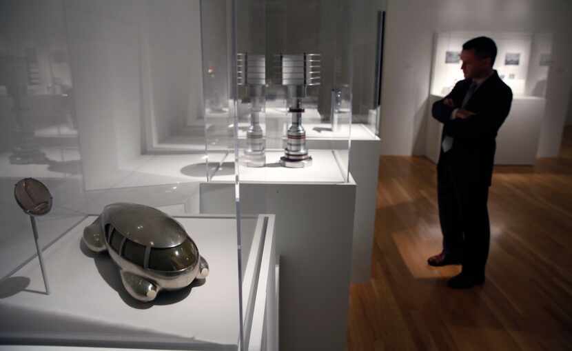 Mark Mitchell looks at sculptures including Motor Car No. 8 (front, left) by Norman Bel Geddes 