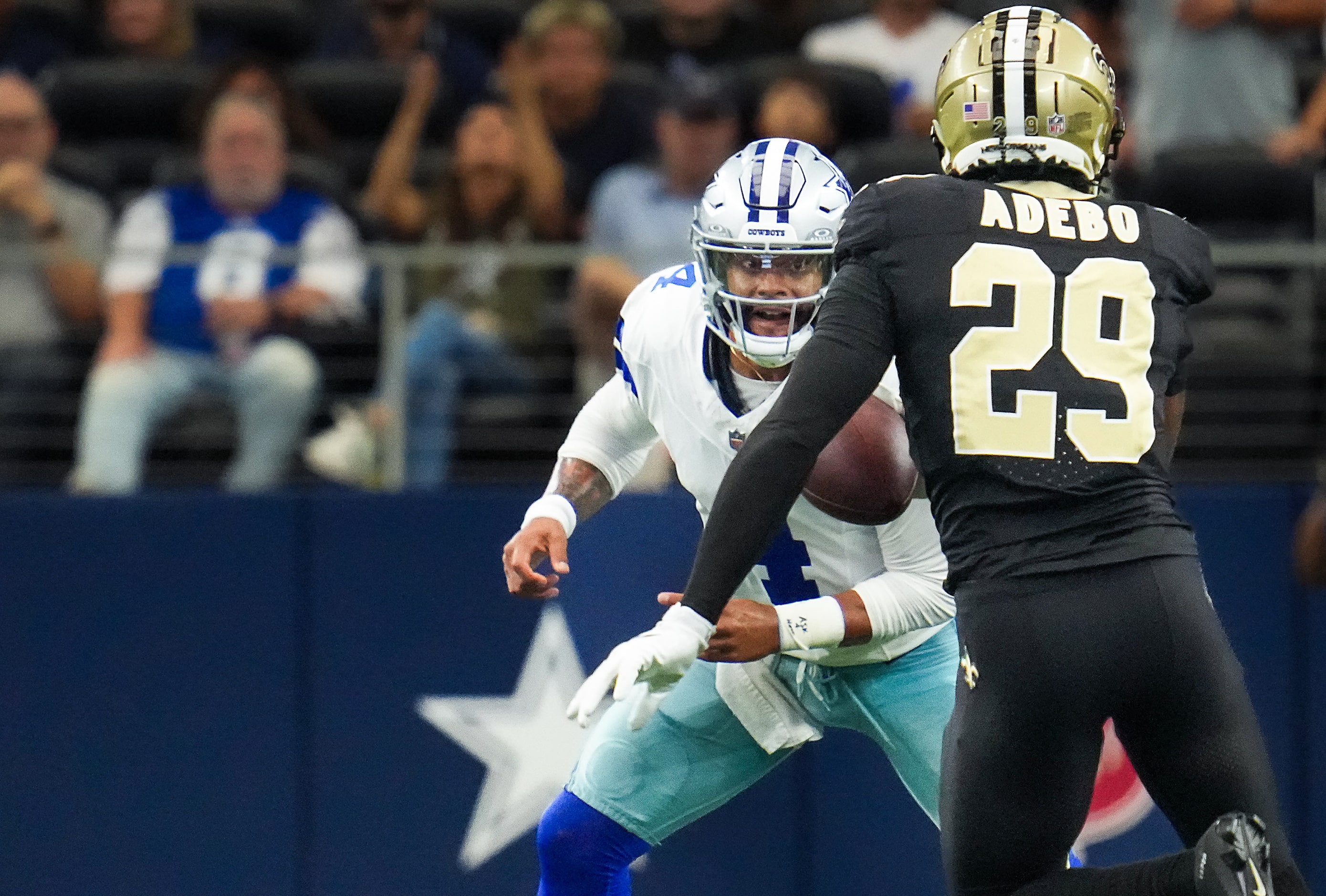 Dallas Cowboys quarterback Dak Prescott (4) prepares to make a tackle on New Orleans Saints...