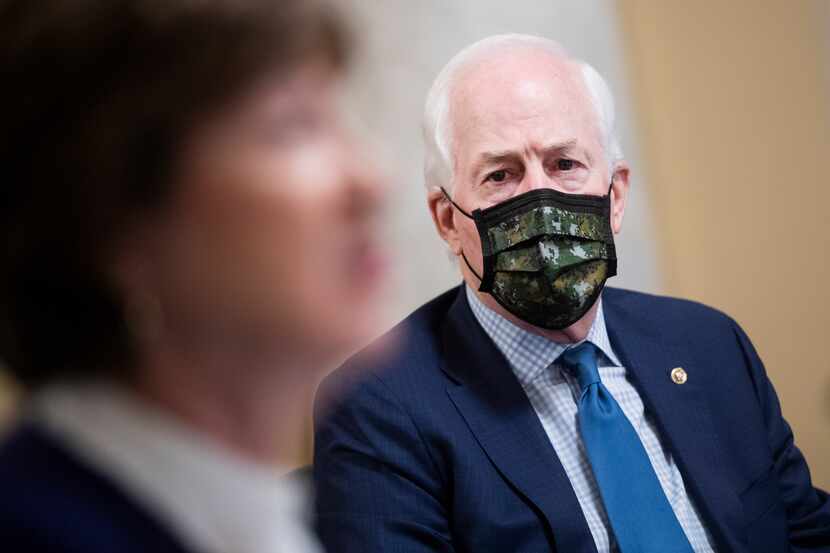 Sen. John Cornyn listens during a Senate Rules Committee meeting on his National Museum of...