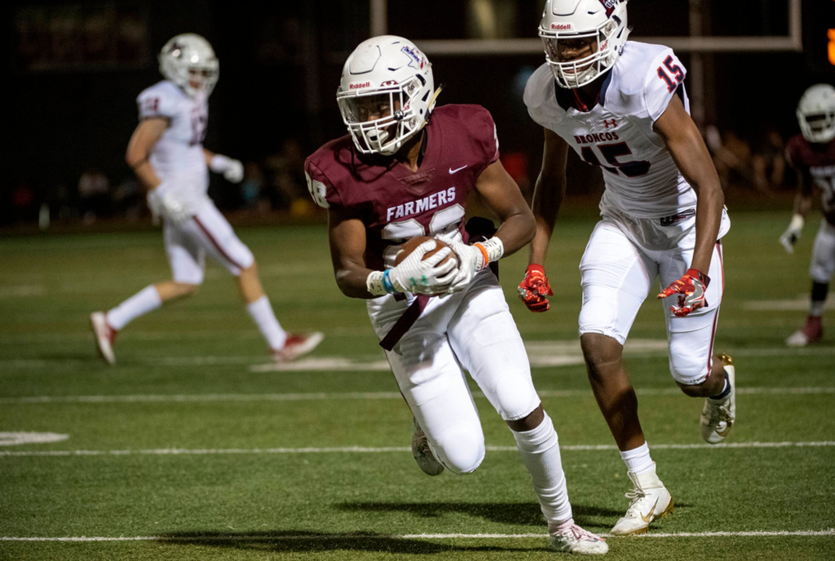 Lewisville senior cornerback Mekhi Barnes-McAlister (28) returns an interception in front of...