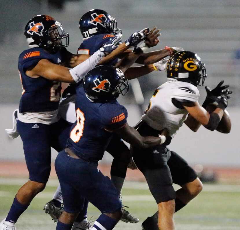 Garland High School wide receiver Sheldrick Davis (5) was unable to make the catch defended...