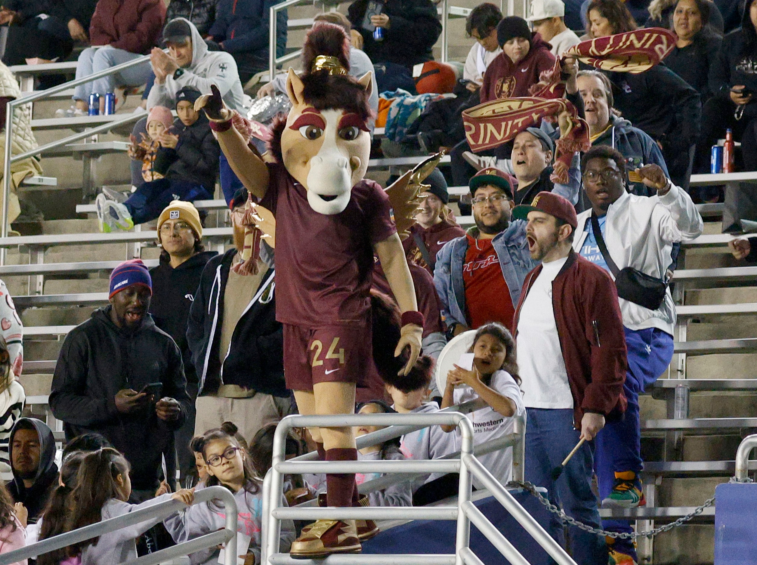 Dallas Trinity FC mascot Boots and fans cheer during the second half of a soccer match...