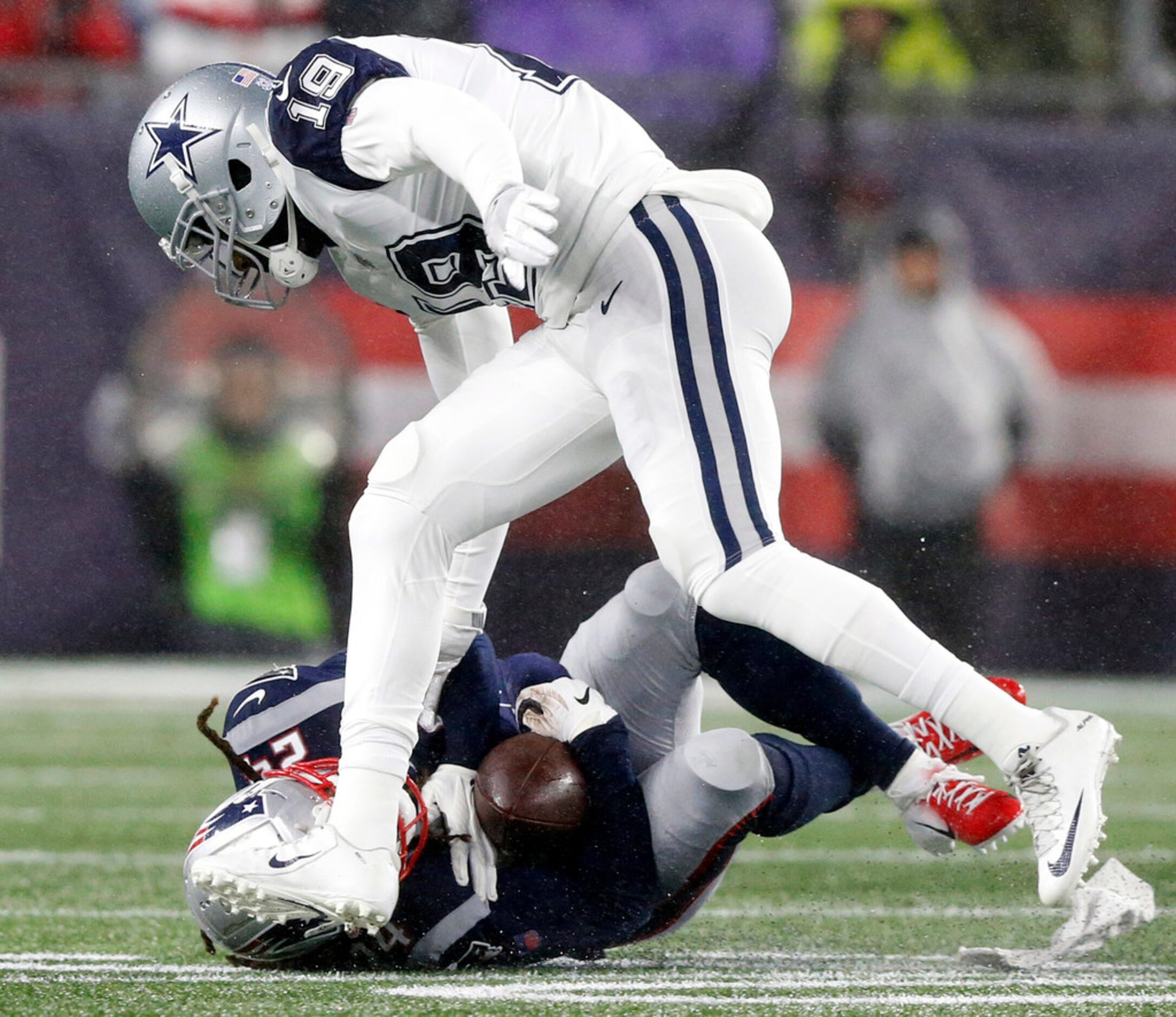 New England Patriots cornerback Stephon Gilmore (24) intercepts a Dak Prescott pass intended...