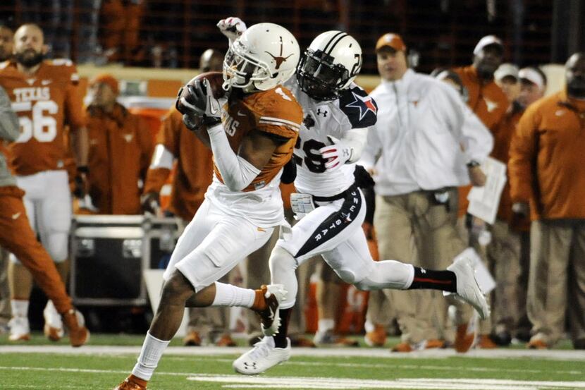 Nov 28, 2013; Austin, TX, USA; Texas Longhorns wide receiver Mike Davis (1) makes a catch...