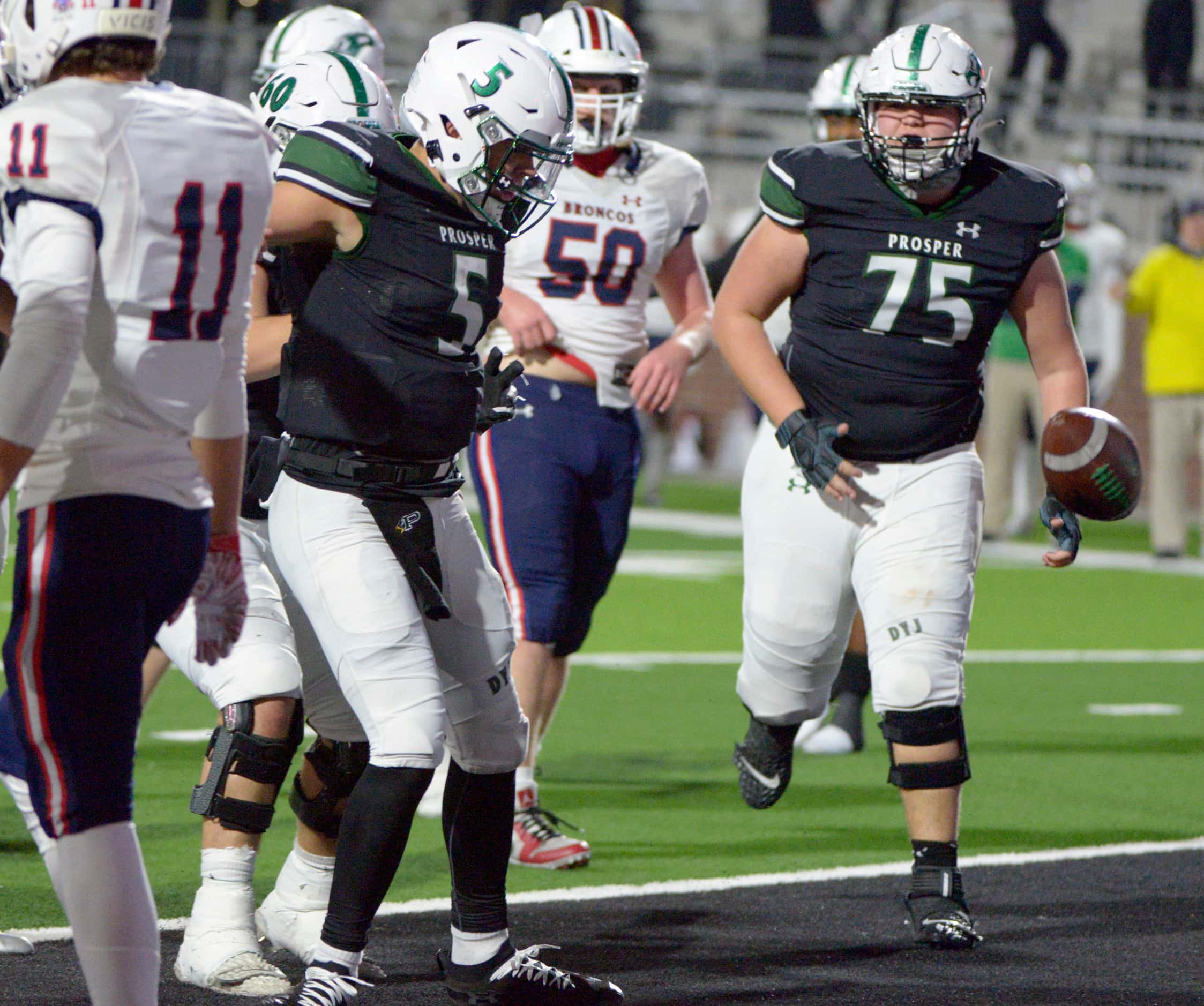 Prosper’s Jackson Berry (5) spikes the ball after his game-winning touchdown in the final...