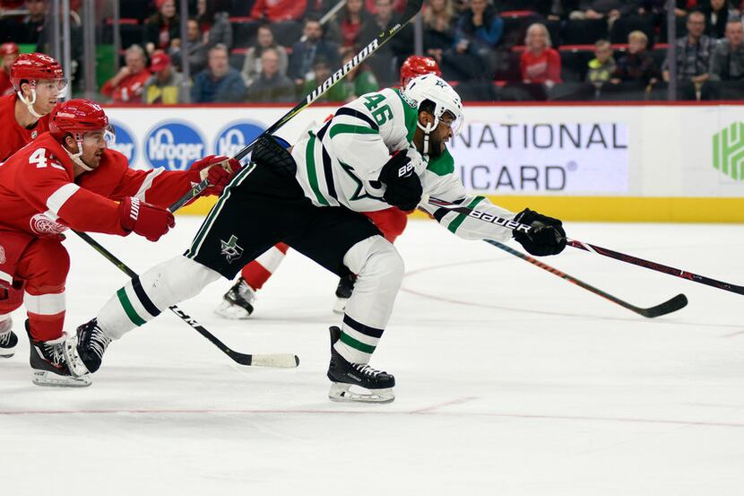 Dallas Stars center Gemel Smith (46) shoots the puck after skating past Detroit Red Wings...