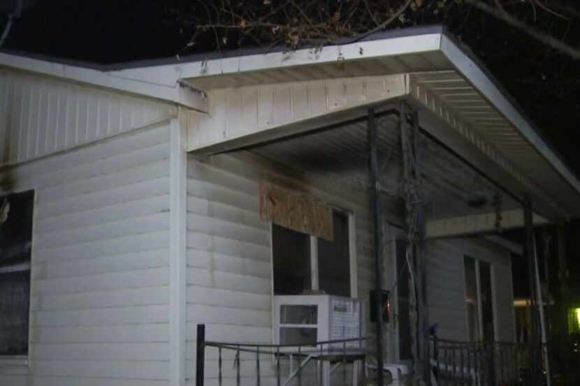An 82-year-old woman was pulled from her home Monday after it caught fire but died later of...
