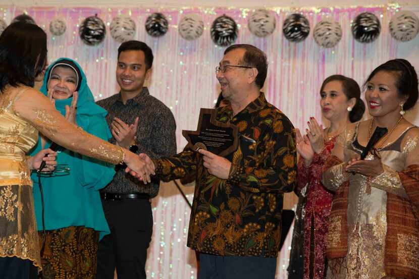 Asman Nasution received  a Texas plaque at an Indonesian festival and goodbye party for him...