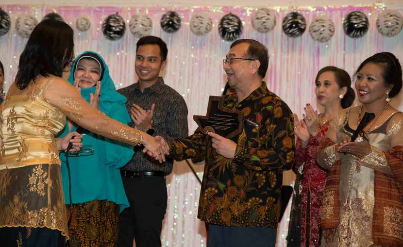 Asman Nasution received  a Texas plaque at an Indonesian festival and goodbye party for him...