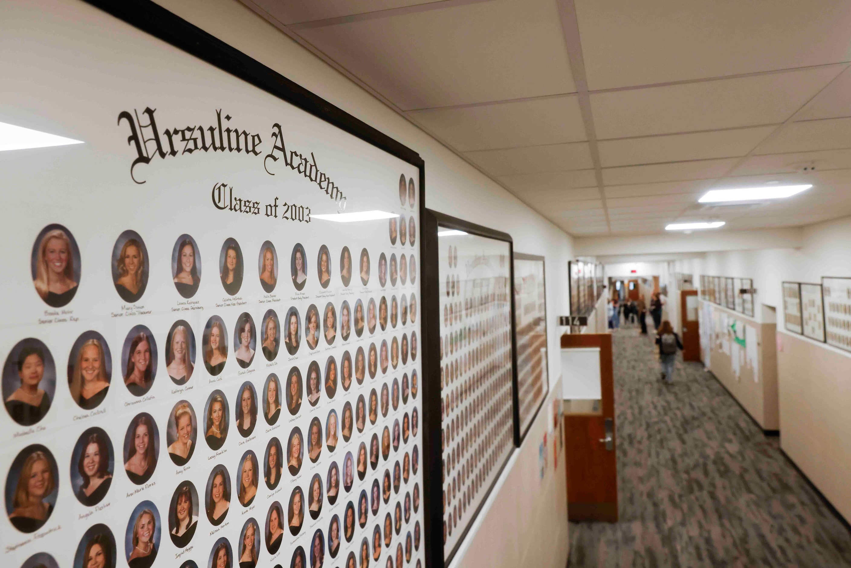 Photos of alumni hang on the wall of Ursuline Academy of Dallas on, Friday, Feb. 2, 2024. 