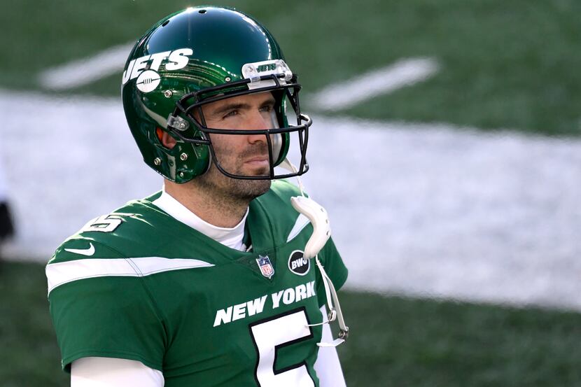 New York Jets quarterback Joe Flacco looks on during the first half an NFL football game...