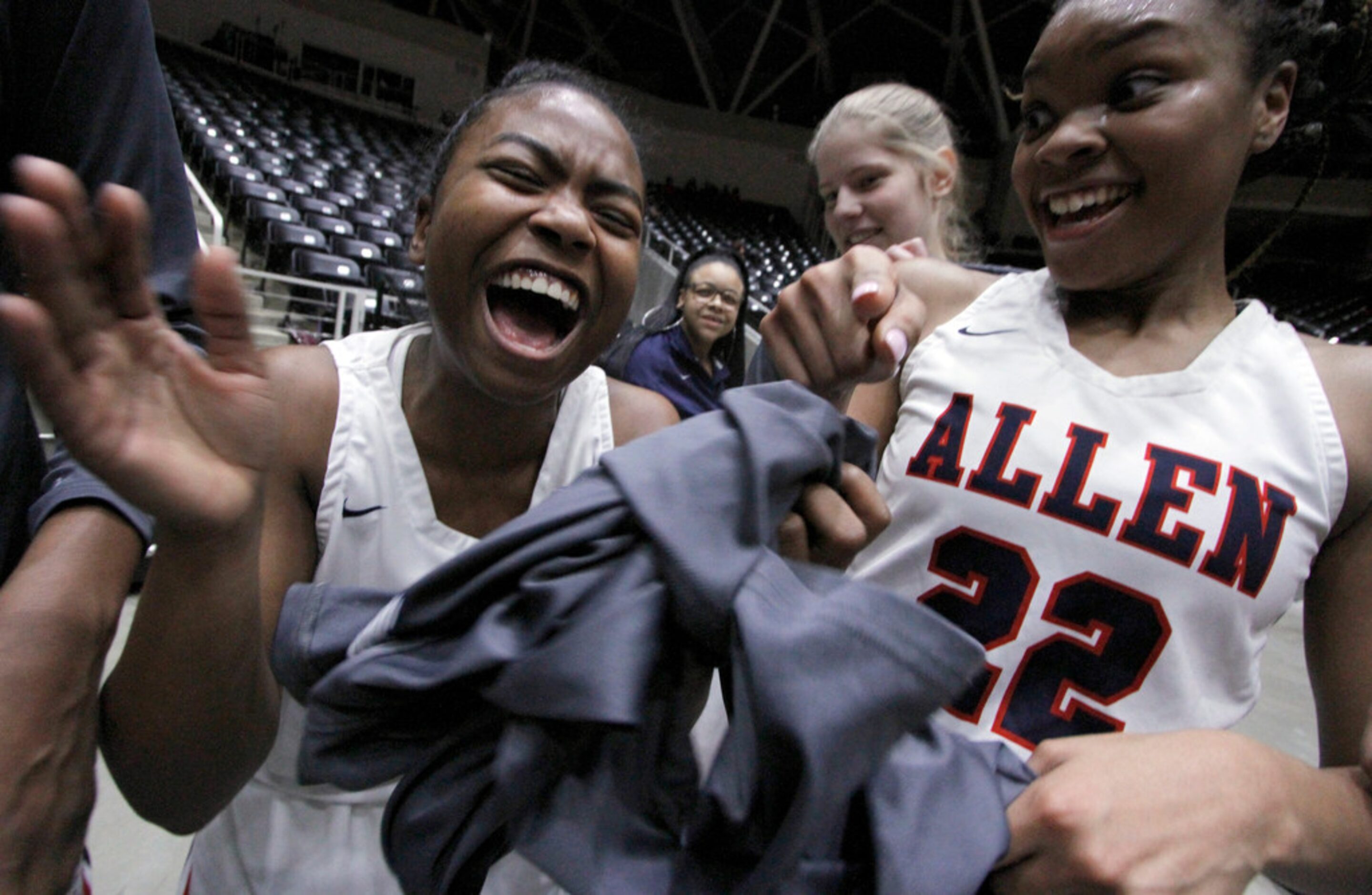 Allen senior guard Cydni Adams (24), left, revels in the moment as she celebrates with...