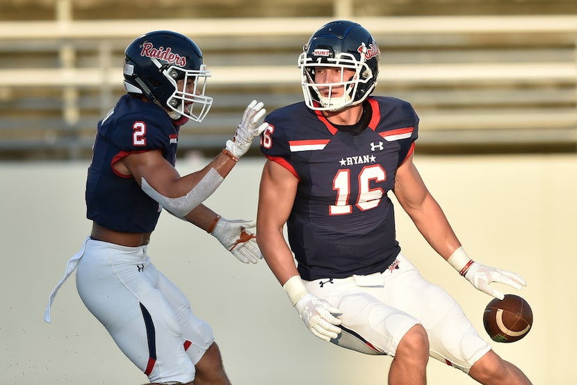 Ryan linebacker Drew Sanders (16) and Ryan defensive back Billy Bowman Jr. (2)  celebrate...