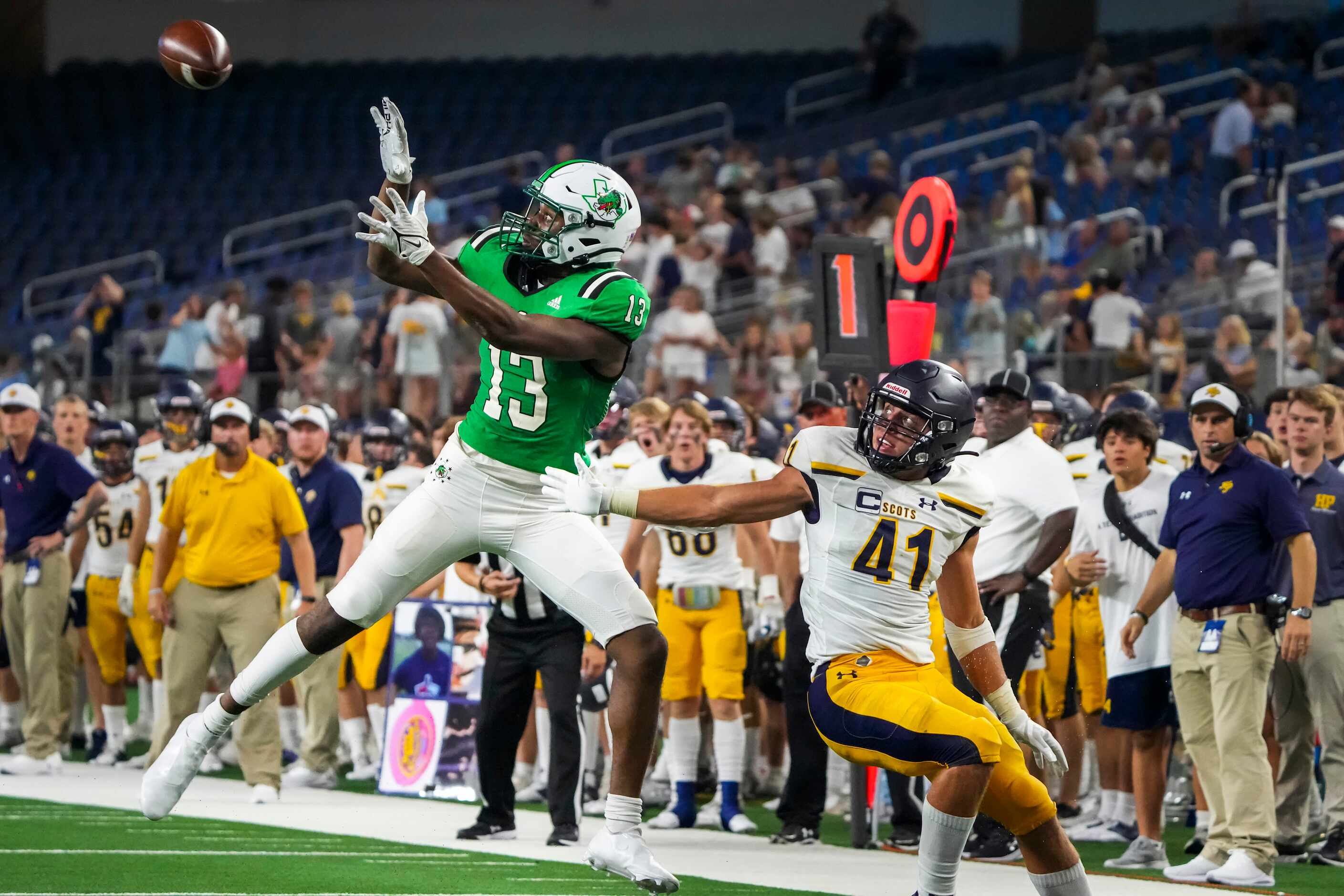 Southlake Carroll wide receiver RJ Maryland (13) reaches for a pass as Highland Park’s...