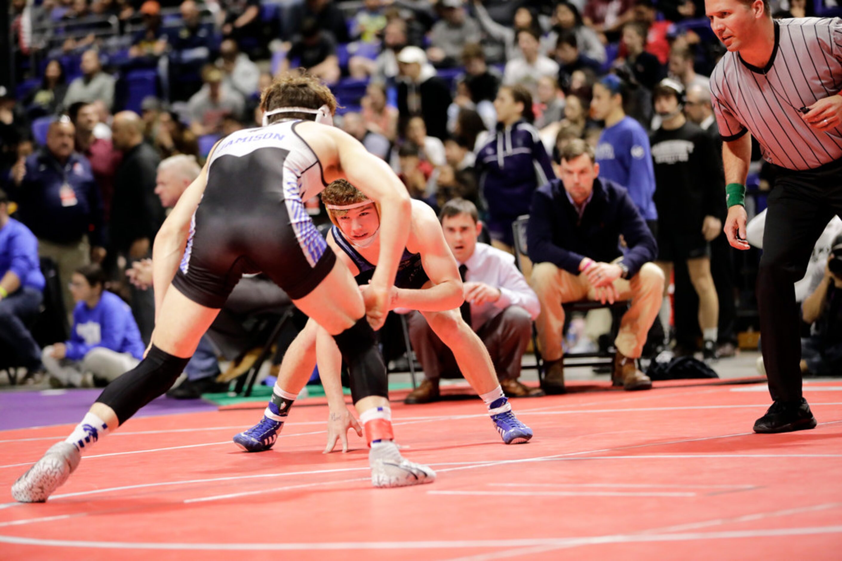 Parker Decker of Keller wrestles against Tagen Jamison of Plano West during the UIL Texas...