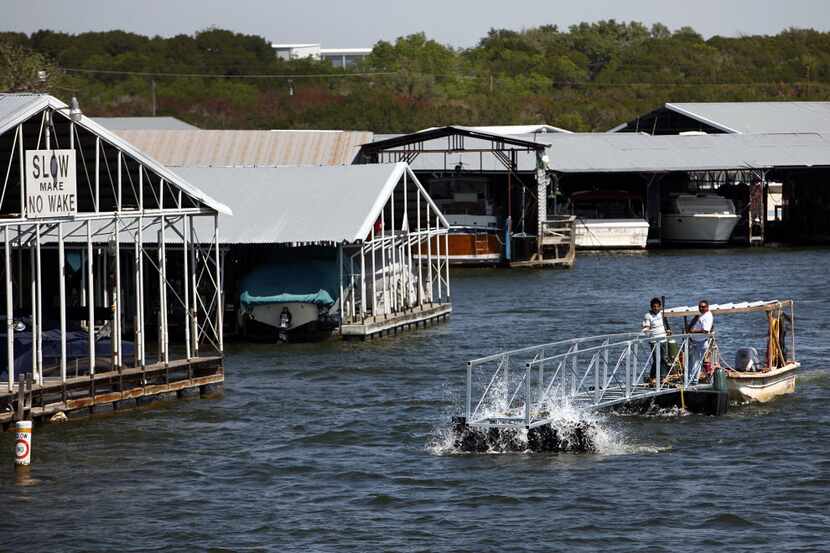 A new boathouse ramp is transported from the marina to a lakeside home on Possum Kingdom...
